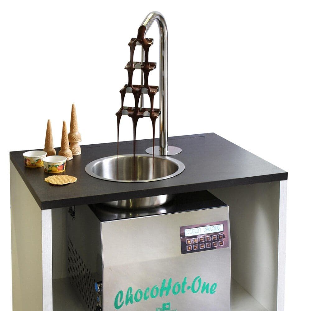 ICB Fuenty counter-integrated dispenser basin installed flush in a countertop with chocolate fountain flowing in