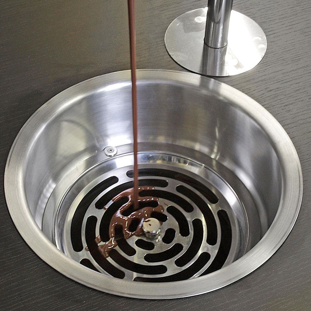 Close-up of the ICB Fuenty stainless steel counter-integrated basin and drain grate