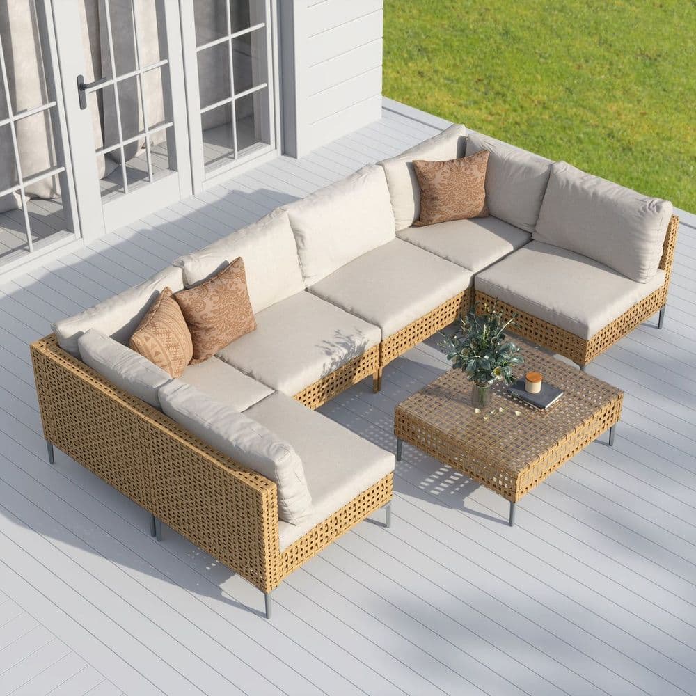 Wicker outdoor sectional sofa set with coffee table on a backyard deck