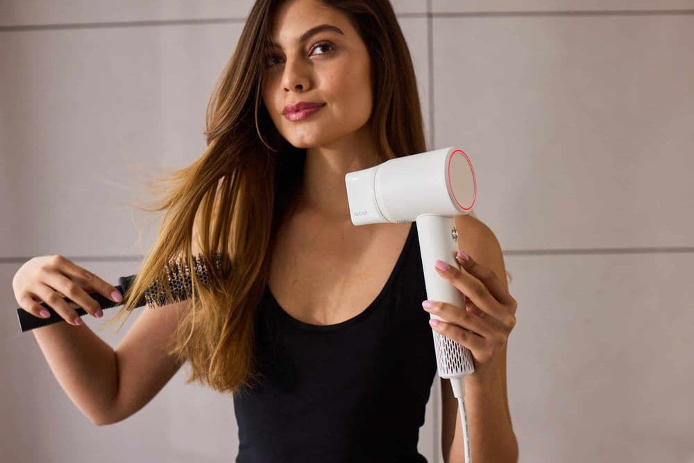 AirCraft AirMotion high-speed hair dryer being used