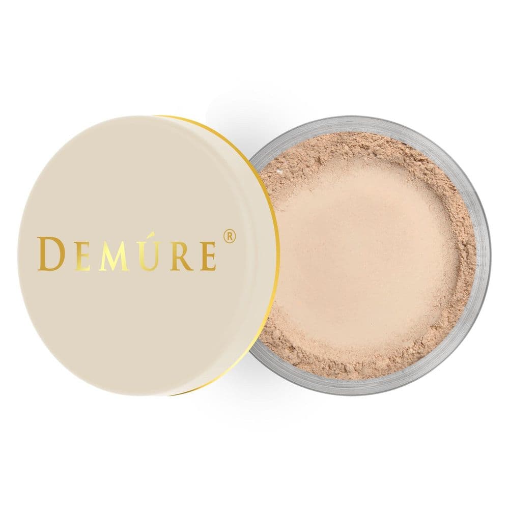 Demure Mineral Foundation loose powder in Medium shade, showing its fine, buildable texture