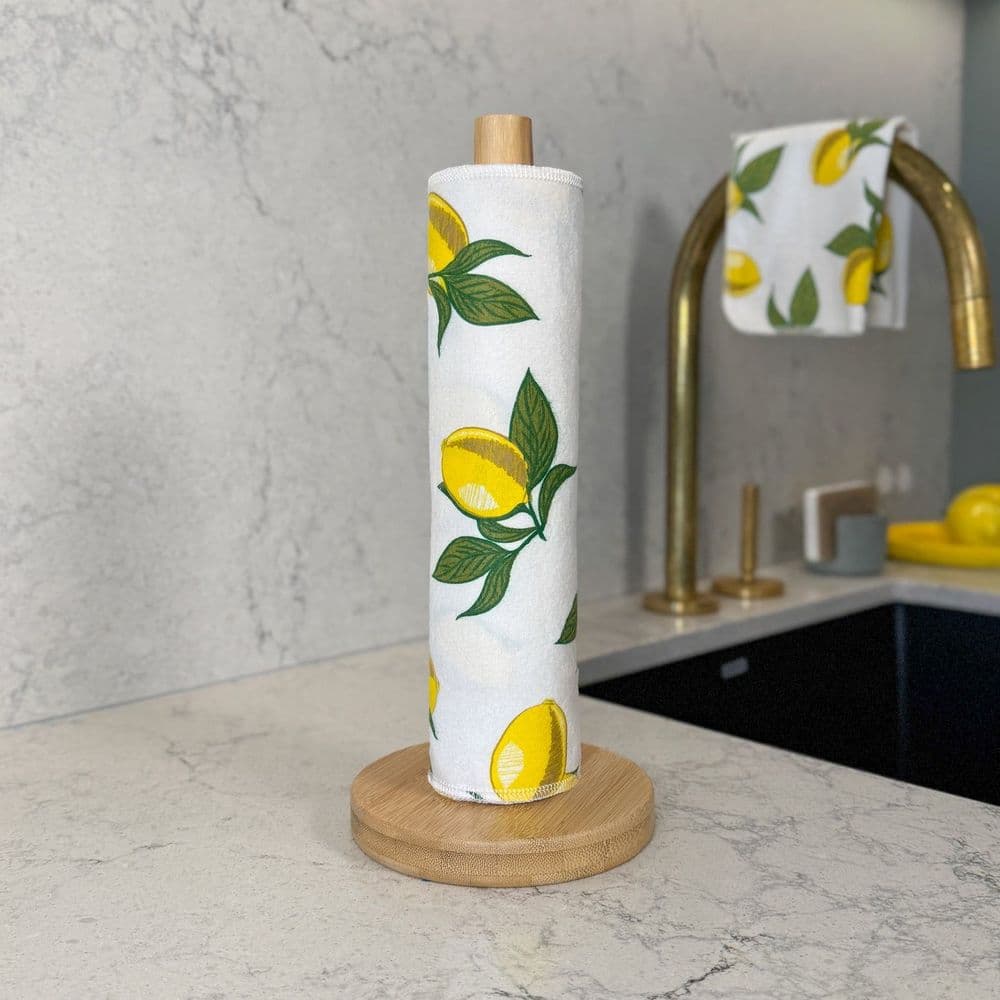 Earthly Co. reusable paper towels in the Picking Lemons print, rolled on a kitchen counter holder